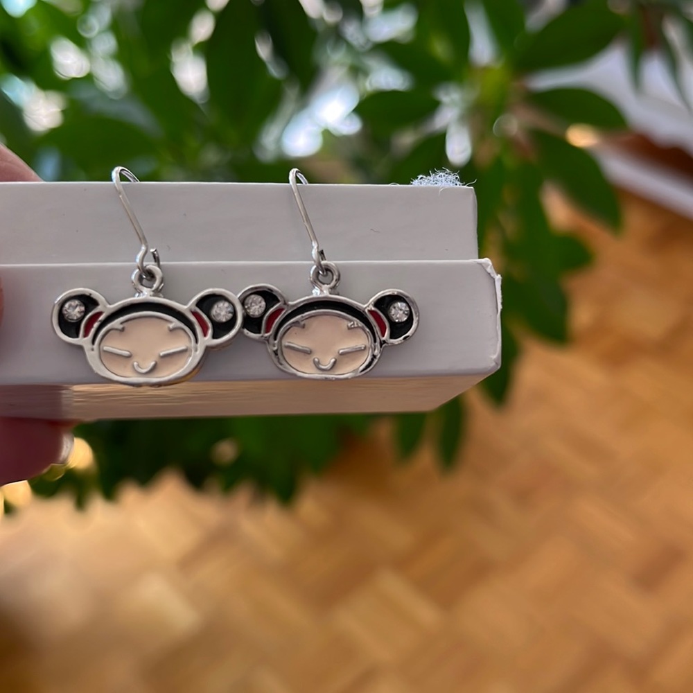 Costume earrings with little faces, PUCCA